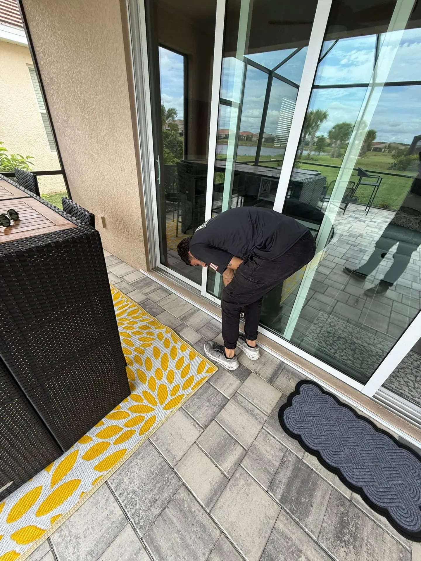 Professional technician working on sliding glass door repair